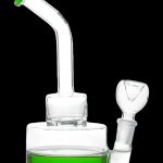 Clear glass water pipe (bong) with green accents and a glass bowl.