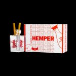 A glass bubbler pipe inside a Chinese takeout-style box branded with “Hemper” and cannabis leaf designs.