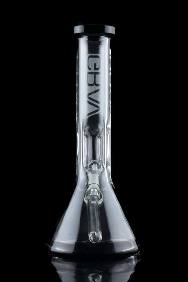 Clear glass water pipe (bong) with ice catch and brand logo, reflecting on a dark surface.