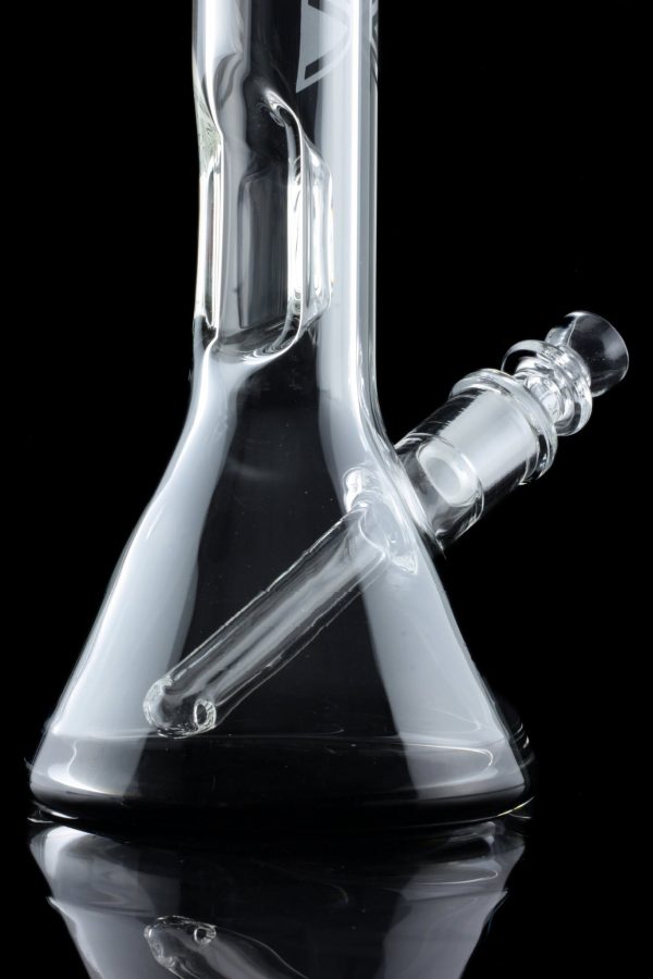 Clear glass water pipe (bong) with ice catcher, reflected on a black surface.