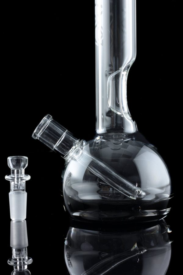 Clear glass bong and bowl with reflective surface, isolated on black.