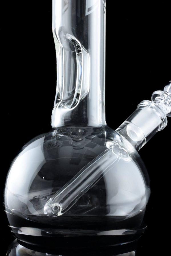 Clear glass water pipe (bong) with intricate swirls and a downstem, isolated on a black background.