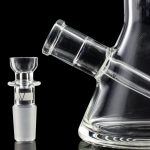 A studio shot of the GRAV® 8" Basic Beaker Bong, showcasing its clear glass construction and reflective surface.