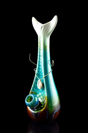 Iridescent glass water pipe with a teal and green swirl pattern, displayed against a black background.