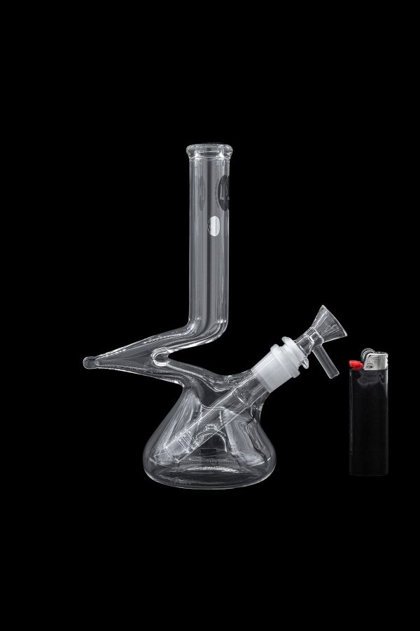 Clear glass bong with a bowl piece and lighter on a black background.