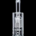 Clear glass dab rig with intricate percolator, isolated on black.