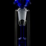 Blue glass bubbler water pipe against a black background.