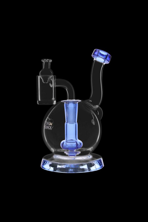 Blue glass dab rig with a quartz banger, isolated on a black background.
