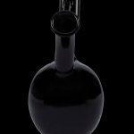 Black glass bubbler for smoking cannabis.