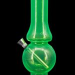 Green acrylic bubbler water pipe with a metal mouthpiece, isolated on a black background.