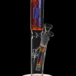 A colorful glass water pipe (bong) with psychedelic patterns and intricate glasswork.
