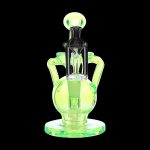 Green glass rig with intricate bubbler and mouthpiece.