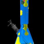 Front view of the Famous Design-Privilege Water Pipe, a tall glass piece with a blue hue and patterned accents.