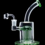 Green glass dab rig with multiple percolators and a quartz banger.