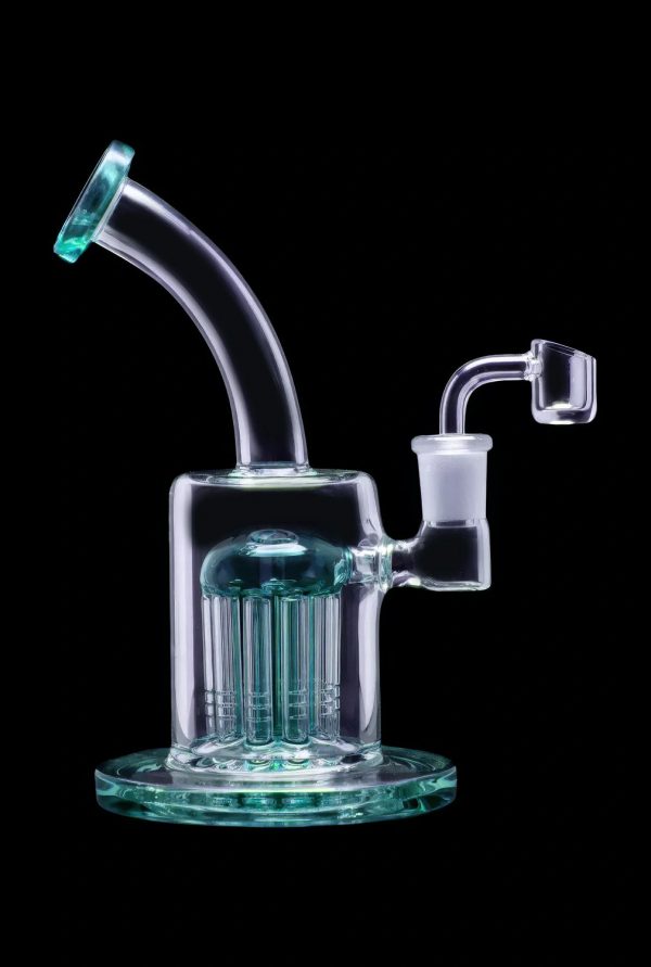 Glass dab rig with multiple diffusion towers, isolated on a black background.