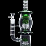 Green and clear glass water pipe (bong) with intricate percolators.