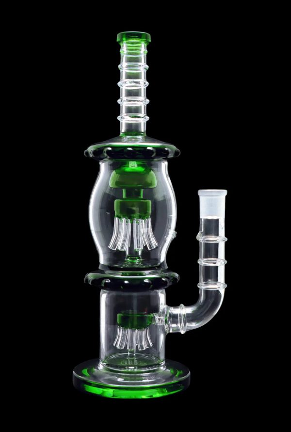 Green glass water pipe (rig) with percolators, isolated on black.