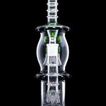 Green and clear glass water pipe (rig) with percolators, isolated on black.