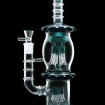 A studio shot of the 13.5-inch Smoke Cartel Straight Tube with Dual Octopus Perc, showcasing its clear glass construction and unique perc design.