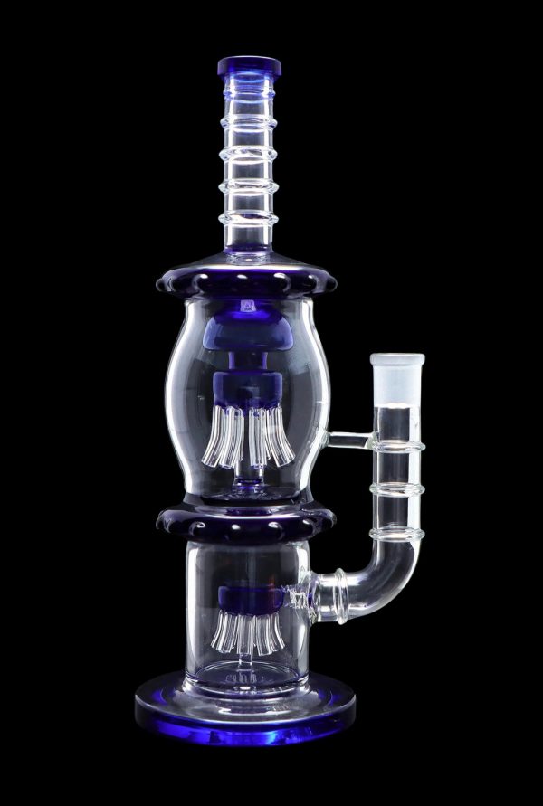 Blue glass water pipe with multiple percolation chambers.