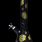 Black glass bong decorated with golden honeycomb and bee motifs.