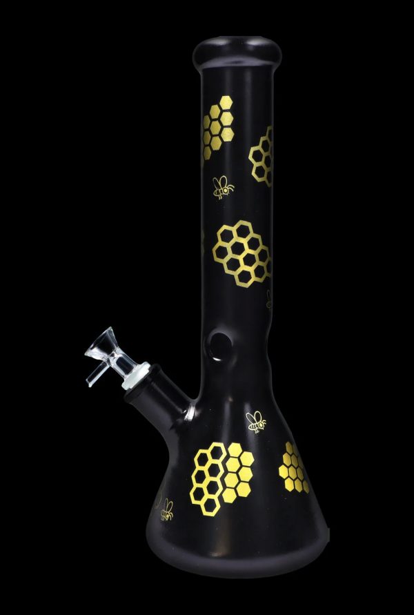 Black glass bong decorated with golden honeycomb and bee motifs.