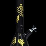 Black glass bong with gold honeycomb pattern.