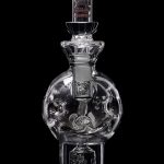Clear glass water pipe with intricate bubble and swirl design, isolated on a black background.