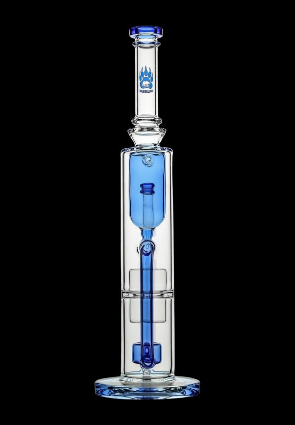 Blue glass water pipe (bong) with intricate bubbler design.