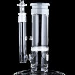 Clear glass water pipe (bong) with percolator, displayed against a black background.