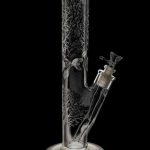 Front view of the Glow in the Dark Tree Water Pipe, a tall, clear glass pipe with a tree branch design.
