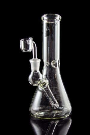 Clear glass water pipe (bong) with a quartz banger, studio shot on a black reflective surface.