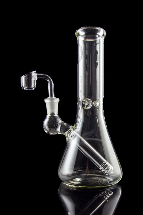 Clear glass bong with a quartz banger, isolated on black.