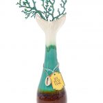 A front view of the My Bud Vase "Mermaid" Water Pipe, featuring a blue-green glass base with a detailed, sculpted top.