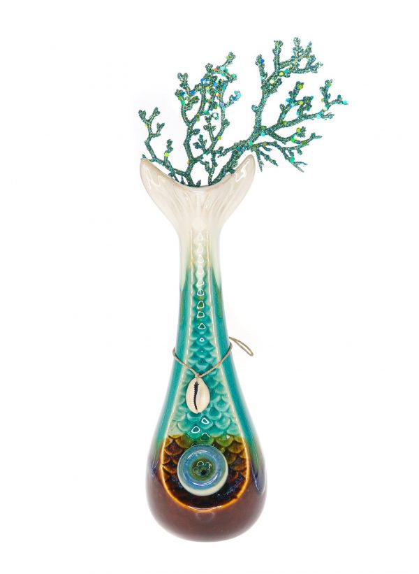 Front view of the “My Bud Vase “Mermaid” Water Pipe”, showcasing a uniquely shaped glass piece with blue accents resembling ocean coral.