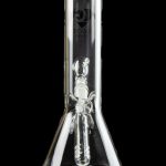 Clear glass bong with intricate sculpted artwork inside, reflecting on a glossy black surface.