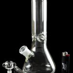 Glass bong with removable downstem and bowl, positioned next to a lighter on a reflective black surface.