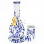 A detailed, angled view of the "My Bud Vase "Luck" Porcelain Vase Bong" featuring intricate floral designs on white porcelain.