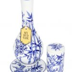 A slightly angled view of the “My Bud Vase “Luck” Porcelain Vase Bong,” featuring a delicate floral pattern on white porcelain.