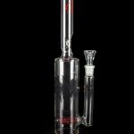 Clear glass water pipe (bong) with intricate etched designs and a translucent joint, isolated on a black background.