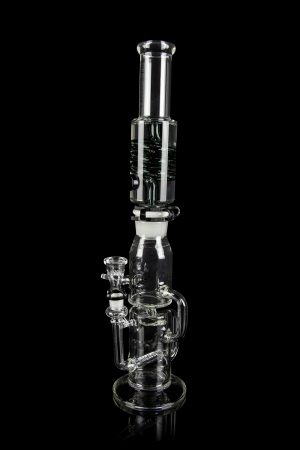 Clear glass water pipe (bong) with multiple chambers and a glass bowl, isolated on a black background.