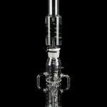 Clear glass water pipe (rig) with multiple chambers and percolators, isolated on a black background.