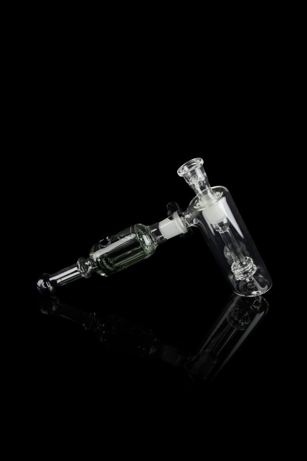 Clear glass rig with intricate bubbler and joint connection, isolated on black.