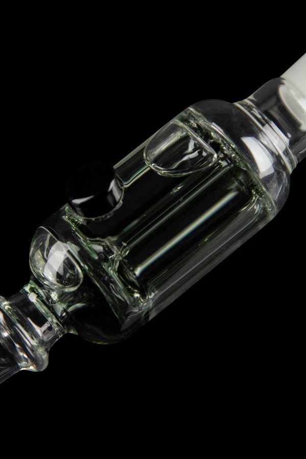 Clear glass bubbler with intricate swirling design, isolated on black.