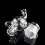 Clear glass rig with intricate bubbler design, isolated on a black background.