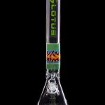 Green and colorful glass bong with intricate design and water filtration system.