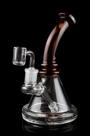A clear glass rig with a colored mouthpiece and a quartz banger, isolated on a black background.