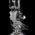 Clear glass water pipe (bong) with intricate curves and a removable downstem, isolated on a black background.