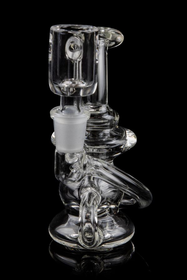 Clear glass water pipe (bong) with intricate curves and a removable downstem, isolated on a black background.