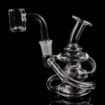 Clear glass dab rig with intricate looping design and quartz banger, isolated on black.